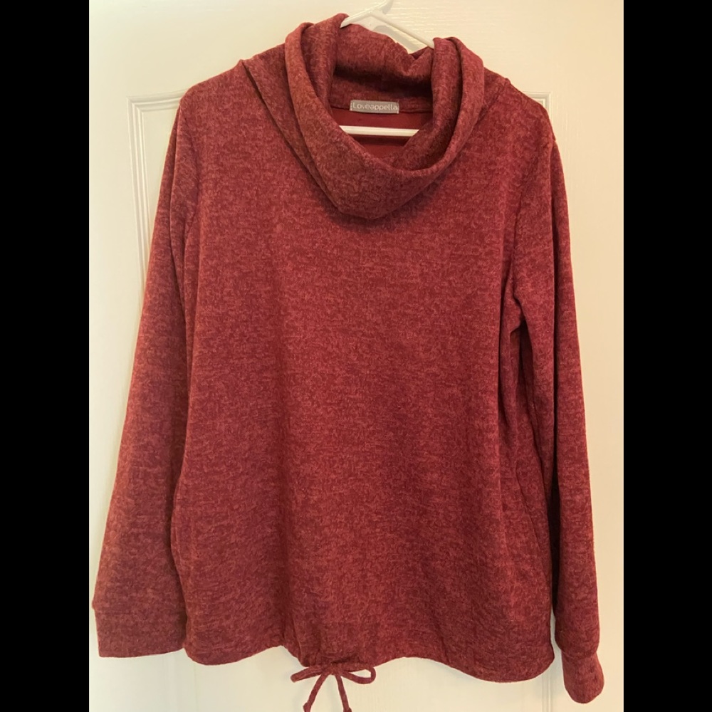 Long sleeve cowl neck shirt. Tie bottom